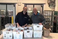 Hyde Park Steward Joe Debarardinis and Branch #34 Executive VP Kevin Flaherty sort food brought back by Hyde Park Letter Carriers.